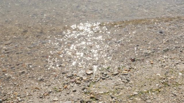River bank shallow wavy crystal clear water 4K 2160p 30fps UltraHD footage - relaxing scene of sun reflection on river surface 4K 3840X2160 UHD video 