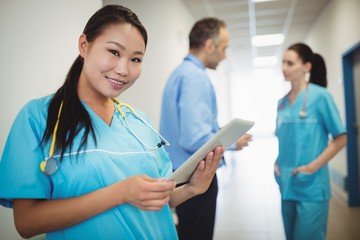 Nurse holding digital tablet in hospital