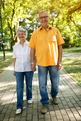 Couple walking through the park