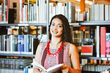 Smiling indian woman at the library