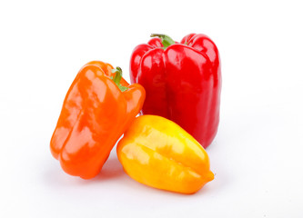 varicolored bell peppers on white background