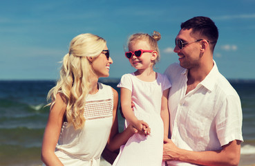 happy family in sunglasses on summer beach