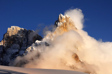 Dolomites Alps, South Tyrol, Italy. Cimon della Pala or Cimone with clouds in the Pale di San Martino Group.