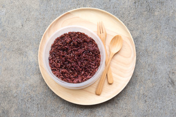 Cooked rice berry on wooden plate