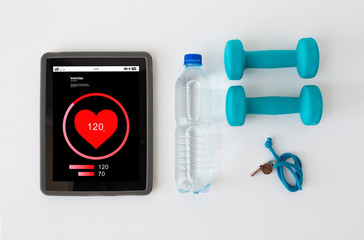 tablet pc, dumbbells, whistle and water bottle