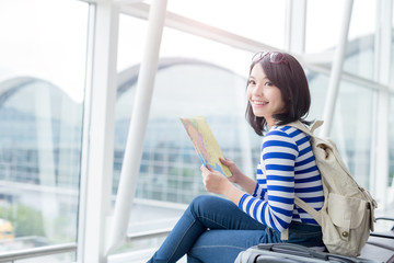  woman take map and smile