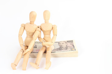 デッサン人形と札束と家