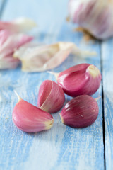 fresh garlic on wooden surface