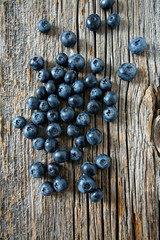 blueberries on wooden surface