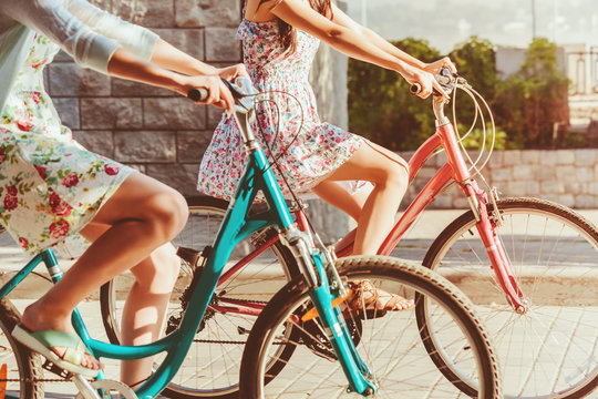 The Two Young Girls With Bicycles In Park