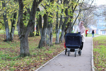 girl in the park with stroller
