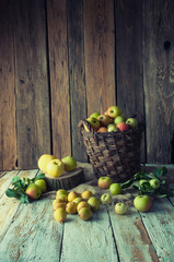 Wild apples and pears in basket