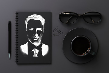 Black desktop with drawn portrait