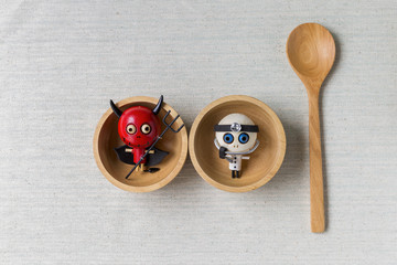 Hallow ween kitchen, Ghost doll in wooden bowl on canvas background