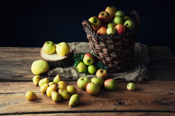 Wild apples and pears in basket