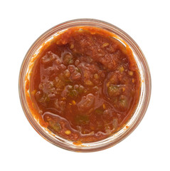 Opened jar of chunky salsa sauce on a white background.