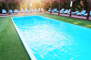 Lounge chairs near pool