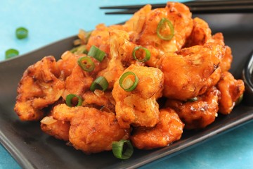 Gobi Manchurian - Indo chinese appetizer using cauliflower florets, selective focus