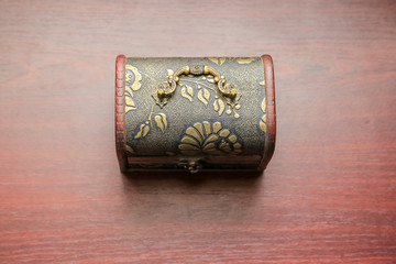 Old wooden chest with open lit and wooden chest with closed lit inside.