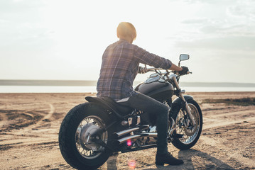 Plakat man riding motorcycle