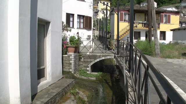 Litte river in the street in Panagia, Thassos Greece