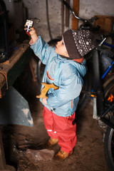  Little boy discovering tools