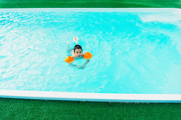 Boy learning to swim