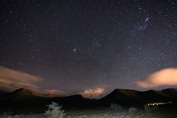 Naklejka premium The starry sky captured Karoo National Park, South Africa, in winter. The Pleiades star cluster, Orion and Taurus Constellation clearly visible.