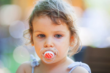 Girl with a pacifier