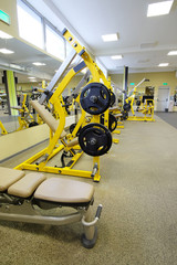 Interior of a fitness hall with wights and other sport equipment