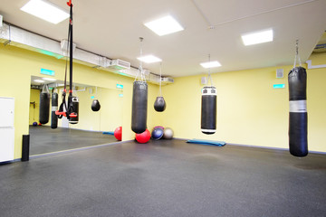 Interior of a fitness hall with punching bags