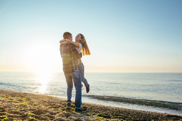 young loving couple having fun on beach