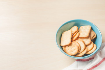 crackers cheese and crackers sugar in color bowl on wood table,