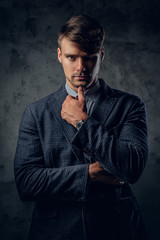 portrait of male on grey background.