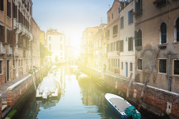 Famous Venetian water canals, historic houses and boats.