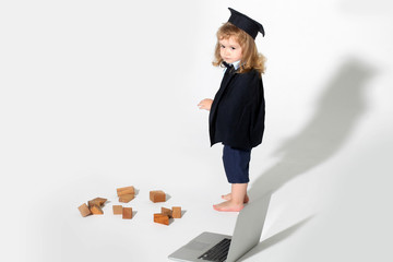 education boy with wooden blocks isolated