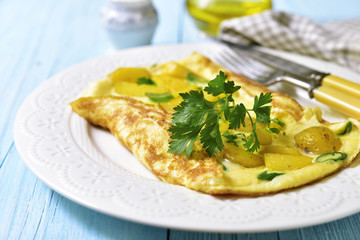 Omelet stuffed with potato and cheese.
