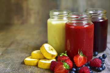 Three portions of different smoothies.