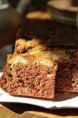 Apple and peach cake in sunshine, closeup. selective focus