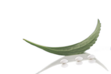 Fototapeta premium Analogue of sugar cubes and stevia leaf