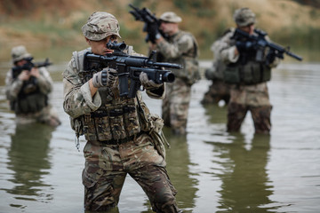 Fototapeta premium special forces soldiers with weapon take part in military maneuv