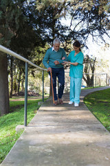 nurse helping a elder man