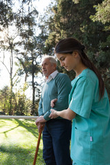 nurse helping a elder man