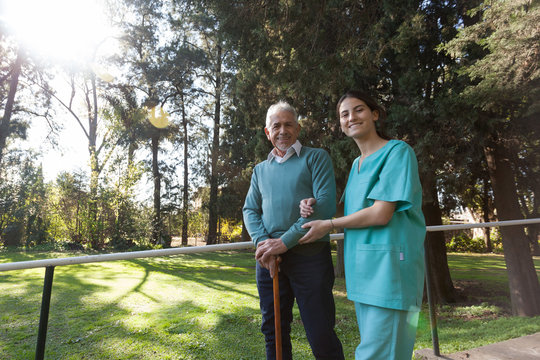 nurse helping a elder man