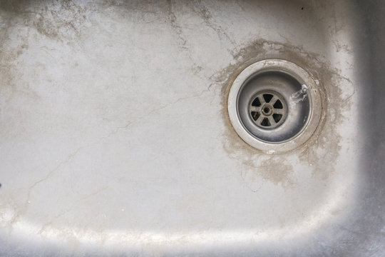 old dirty sink with scrubber inside