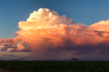 Colorful sky at sunset with cumulonimbus storm clouds