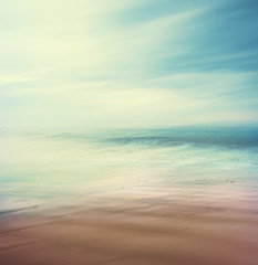 Cross-Processed Sea and Sand. An abstract, time-exposure seascape with panning movement.  Image displays a retro, vintage look with cross-processed colors.