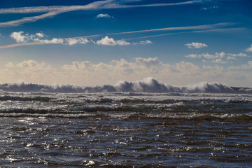 Huge ocean waves blending with skyline near Sagres, Portugal