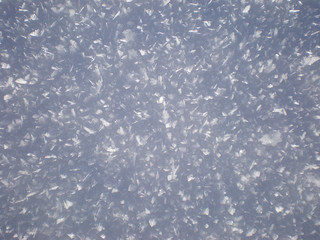 Close up of snow, with visible snow crystals