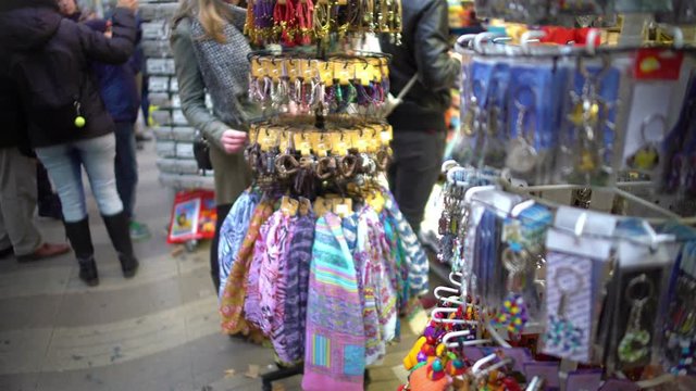 Variety of colorful token gifts at souvenir shop for tourists to remember trip